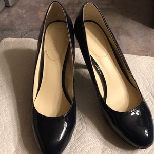 Navy blue patent leather pumps